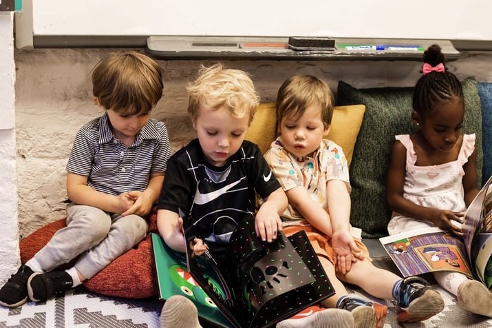 Seedlings students reading books in art class